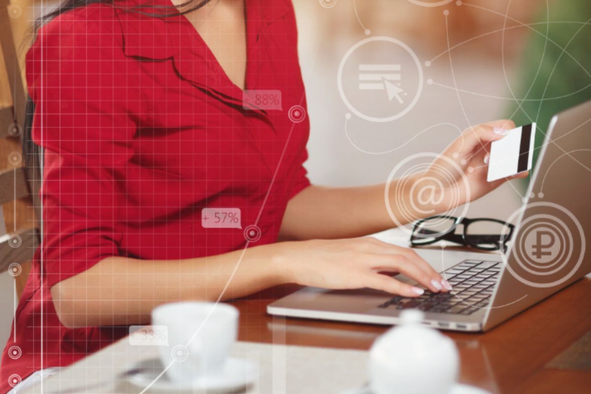 A woman using her card to make an online purchase
